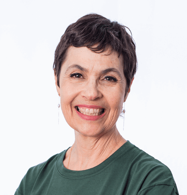 A professional headshot of Adriana Wolffenbüttel, a Ph.D. chemist and aromatherapist, shown from the chest up for her profile.