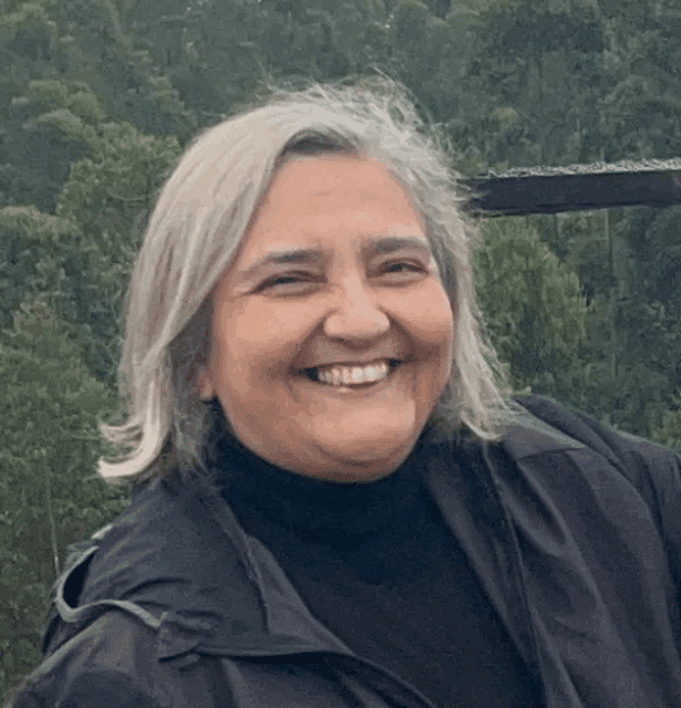 Professional headshot of Cidéli de Paula Coelho, a veterinarian, researcher, and professor of Homeopathy and One Health.