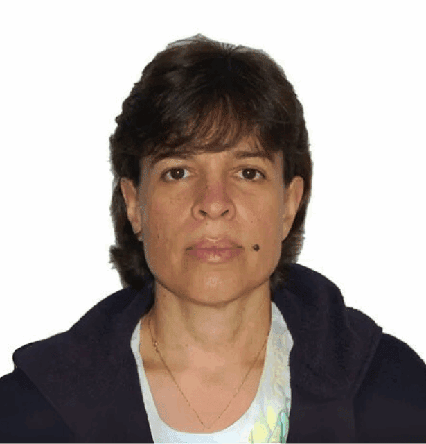 A professional headshot of anthropologist Gina Denyer, a Scientific Committee member specializing in intercultural health policy.