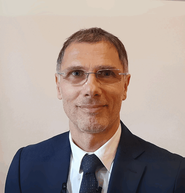 Professional headshot of Henrik Szőke, MD, Associate Professor of Integrative Medicine at the University of Pécs in Hungary.