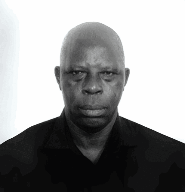 A professional headshot of Lakassa Essossiminam. He is wearing formal attire and looking directly at the camera with a composed expression.